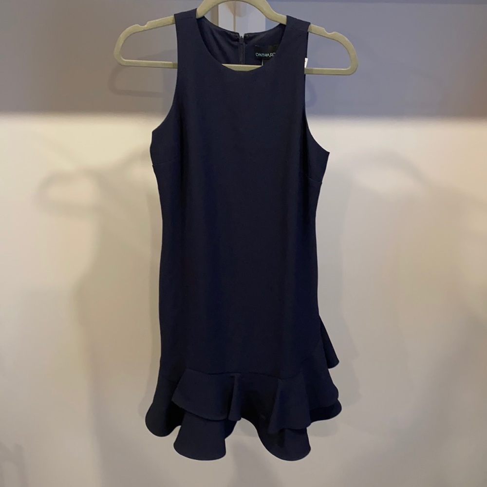 Brand new, never worn. Navy Blue stretchy Racebrack dress with ruffle detail